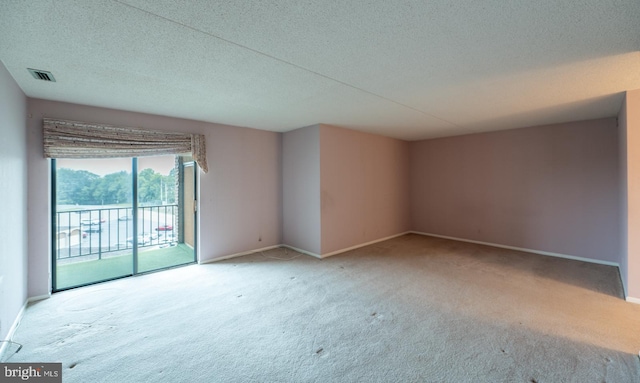 20630 Valley Forge Cir Unit 630, King Of Prussia, PA 19406 - unfurnished room with carpet floors and a textured ceiling
