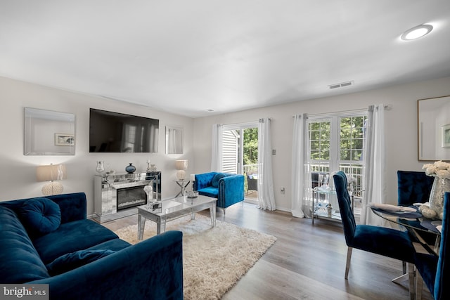 2870 Burgundy Pl, Woodbridge, VA 22192 - living area with a high end fireplace and wood finished floors