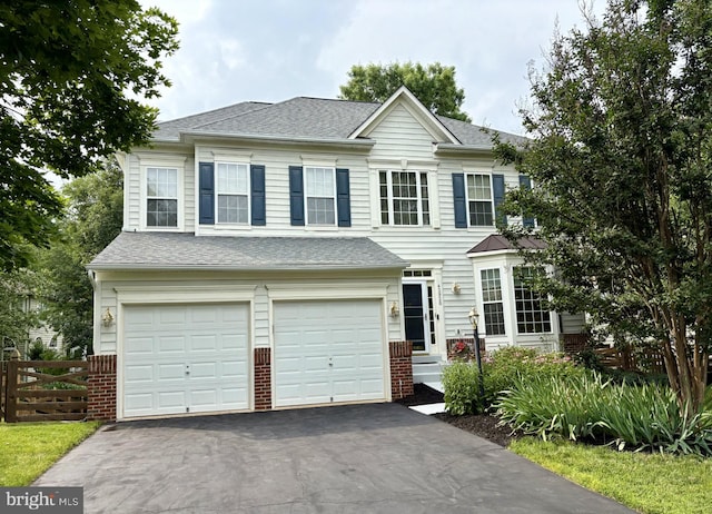 42920 Cattail Meadows Pl, Broadlands, VA 20148 - view of front of home with an attached garage, driveway, and roof with shingles