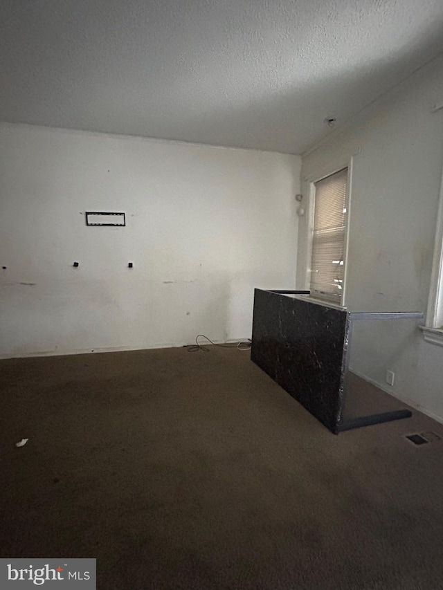 319 Bergen St, Gloucester City, NJ 08030 - carpeted spare room with a textured ceiling