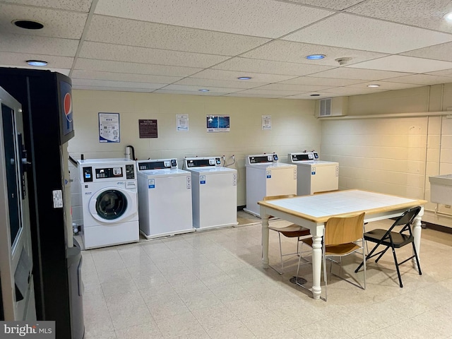 200 Highland Ave Unit 203, State College, PA 16801 - shared laundry with washer and clothes dryer, concrete block wall, and light floors