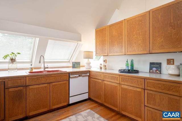 1614 Meadowbrook Heights Rd, Charlottesville, VA 22901 - kitchen with white dishwasher, light countertops, light wood-type flooring, lofted ceiling, and brown cabinets