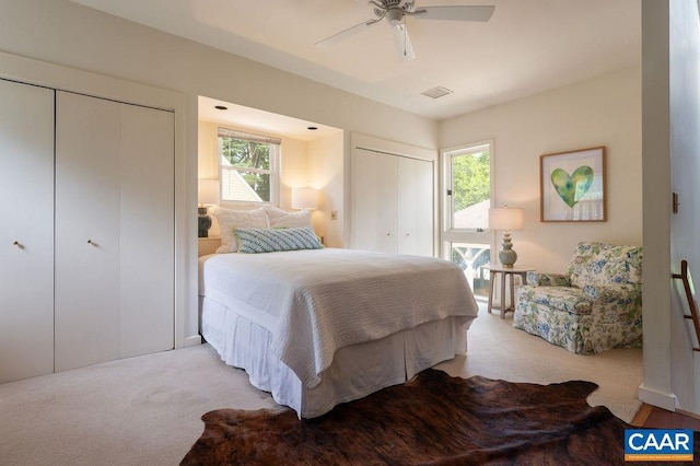 1614 Meadowbrook Heights Rd, Charlottesville, VA 22901 - bedroom featuring multiple closets, light colored carpet, and ceiling fan