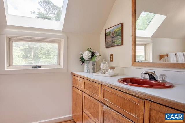 1614 Meadowbrook Heights Rd, Charlottesville, VA 22901 - bathroom with a skylight, vaulted ceiling, and vanity