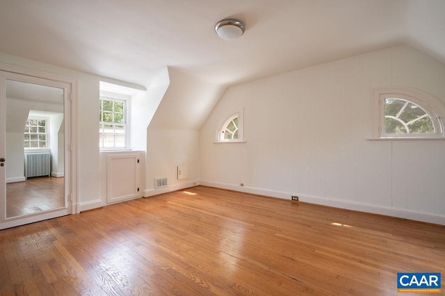 1614 Meadowbrook Heights Rd, Charlottesville, VA 22901 - bonus room featuring radiator heating unit, vaulted ceiling, and light wood finished floors