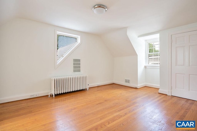 1614 Meadowbrook Heights Rd, Charlottesville, VA 22901 - bonus room featuring radiator heating unit, vaulted ceiling, and wood finished floors