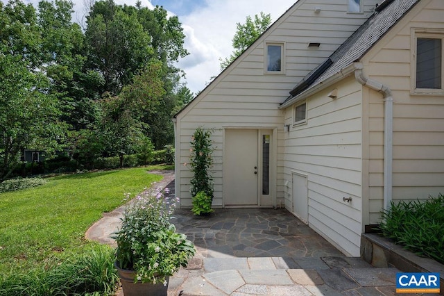 1614 Meadowbrook Heights Rd, Charlottesville, VA 22901 - property entrance featuring a yard, a patio area, and roof with shingles