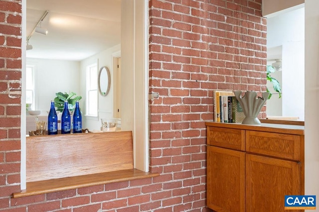 1614 Meadowbrook Heights Rd, Charlottesville, VA 22901 - detailed view of track lighting and brick wall