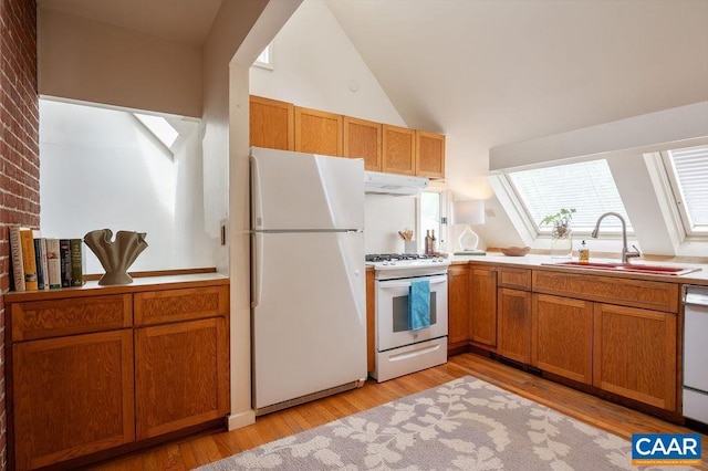 1614 Meadowbrook Heights Rd, Charlottesville, VA 22901 - kitchen featuring white appliances, under cabinet range hood, vaulted ceiling, light wood-style flooring, and brown cabinetry