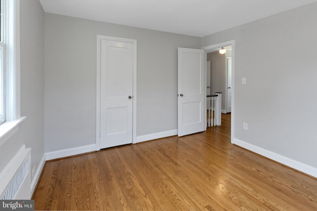 509 Baynard Blvd, Wilmington, DE 19803 - unfurnished bedroom with radiator and light wood-style floors