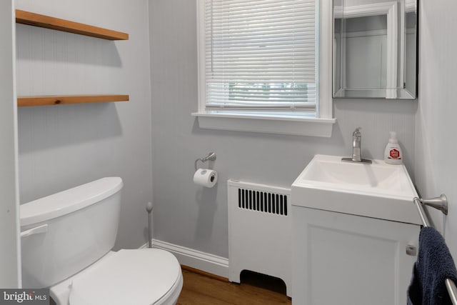 509 Baynard Blvd, Wilmington, DE 19803 - bathroom featuring radiator heating unit, vanity, and wood finished floors