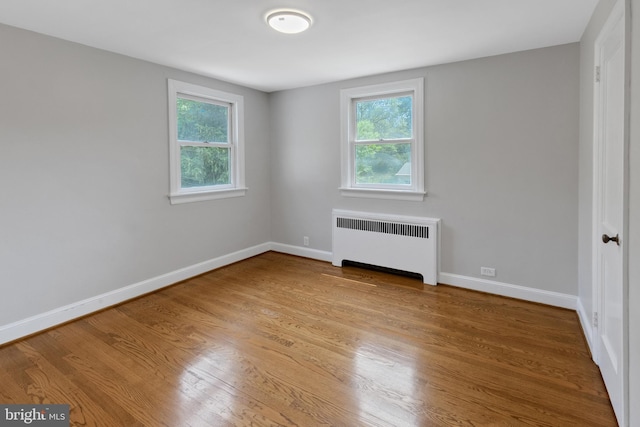 509 Baynard Blvd, Wilmington, DE 19803 - spare room featuring radiator heating unit, healthy amount of natural light, and wood finished floors