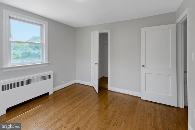 509 Baynard Blvd, Wilmington, DE 19803 - unfurnished bedroom with radiator, wood finished floors, and a closet