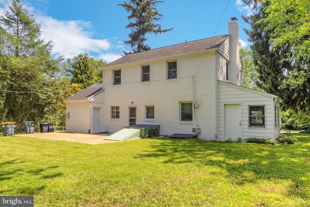 509 Baynard Blvd, Wilmington, DE 19803 - back of property with a patio, a chimney, and a yard