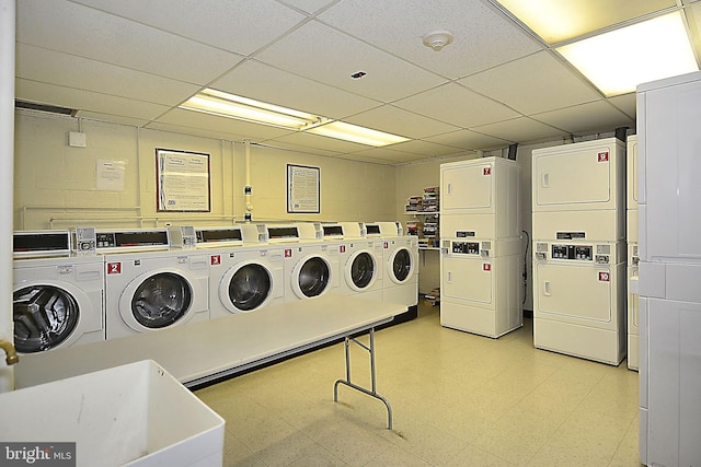 2800 Wisconsin Ave NW Unit 304, Washington, DC 20007 - community laundry with stacked washer / dryer, light flooring, and independent washer and dryer