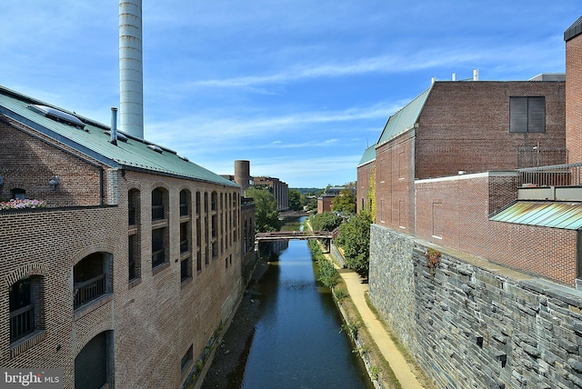 2800 Wisconsin Ave NW Unit 304, Washington, DC 20007 - view of side of property with a metal roof and a water view