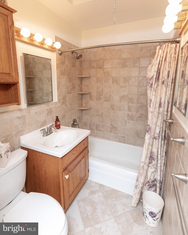 4239 Elbridge St, Philadelphia, PA 19135 - bathroom featuring shower / bathtub combination with curtain, tile walls, and vanity