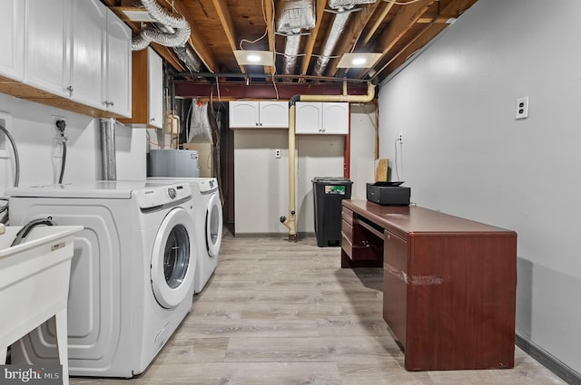 9355 Pan Ridge Rd Unit 9355, Parkville, MD 21234 - laundry room with independent washer and dryer, cabinet space, and light wood finished floors