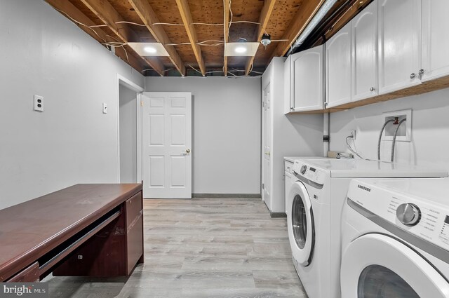 9355 Pan Ridge Rd Unit 9355, Parkville, MD 21234 - laundry room featuring cabinet space, washing machine and dryer, and light wood-style floors