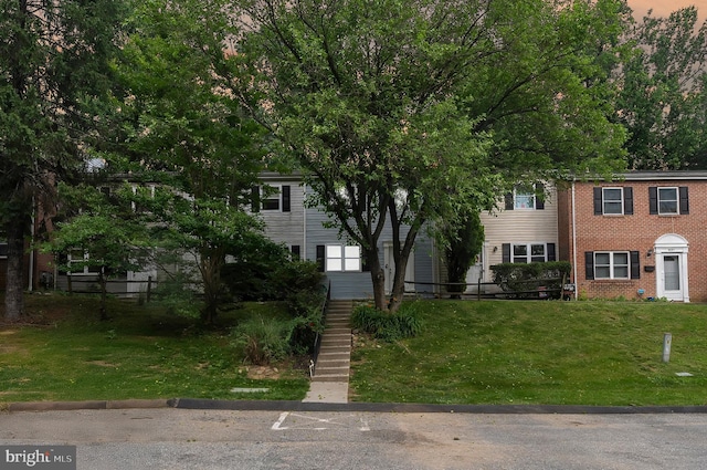 9355 Pan Ridge Rd Unit 9355, Parkville, MD 21234 - view of front of property with stairs, a front lawn, and brick siding