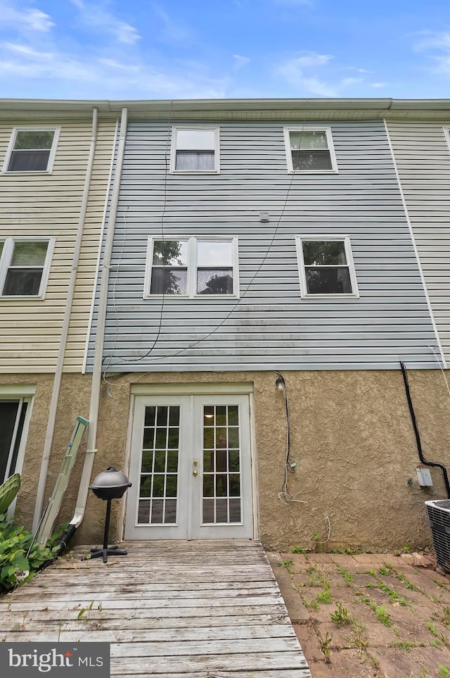 9355 Pan Ridge Rd Unit 9355, Parkville, MD 21234 - rear view of house featuring french doors, stucco siding, and a wooden deck