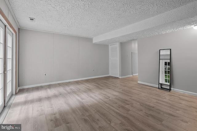 9355 Pan Ridge Rd Unit 9355, Parkville, MD 21234 - empty room with a textured ceiling and wood finished floors