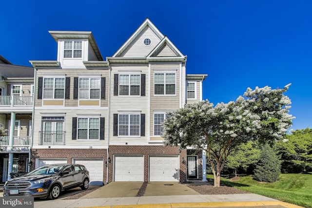 1869 Cedar Cove Way Unit 101, Woodbridge, VA 22191 - view of property with a garage, driveway, and brick siding