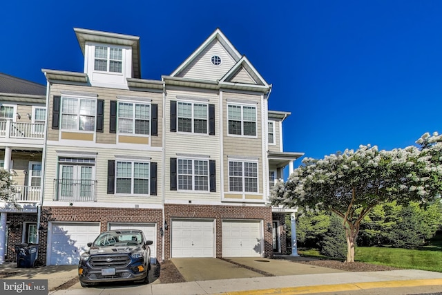 1869 Cedar Cove Way Unit 101, Woodbridge, VA 22191 - townhome / multi-family property with a garage, concrete driveway, and brick siding
