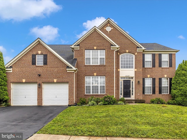 14228 Golden Hook Rd, Boyds, MD 20841 - view of front facade featuring driveway, brick siding, and a front lawn