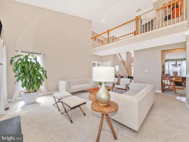 14228 Golden Hook Rd, Boyds, MD 20841 - carpeted living room with a towering ceiling, stairway, a chandelier, and recessed lighting