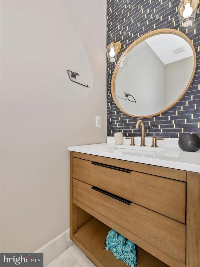 14228 Golden Hook Rd, Boyds, MD 20841 - bathroom featuring tasteful backsplash, vanity, and tile patterned floors