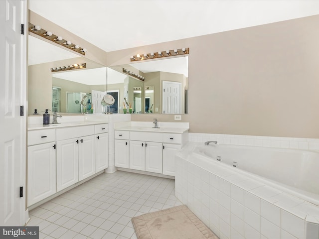 14228 Golden Hook Rd, Boyds, MD 20841 - bathroom featuring a jetted tub, double vanity, and tile patterned flooring