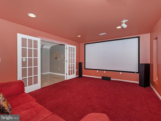 14228 Golden Hook Rd, Boyds, MD 20841 - carpeted home theater with french doors, arched walkways, and recessed lighting