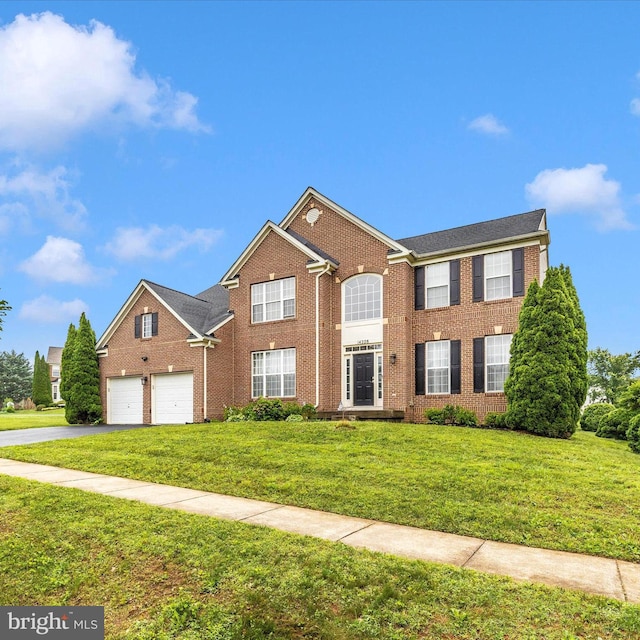 14228 Golden Hook Rd, Boyds, MD 20841 - view of front of home with brick siding, driveway, a front lawn, and an attached garage