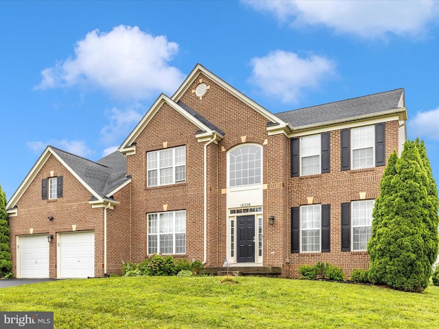 14228 Golden Hook Rd, Boyds, MD 20841 - view of front of home featuring brick siding, asphalt driveway, a garage, and a front yard