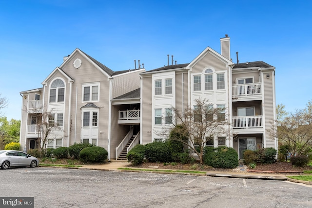 11021 Folksie Ct Unit 201, Manassas, VA 20109 - view of building exterior with uncovered parking