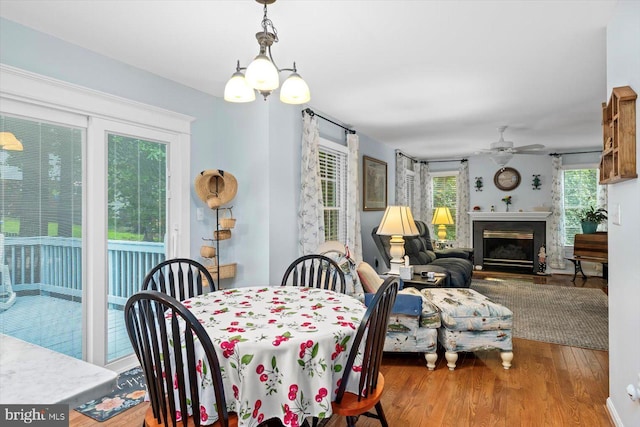 69 Cardinal Forest Dr, Fredericksburg, VA 22406 - dining room featuring wood finished floors, a ceiling fan, and a glass covered fireplace
