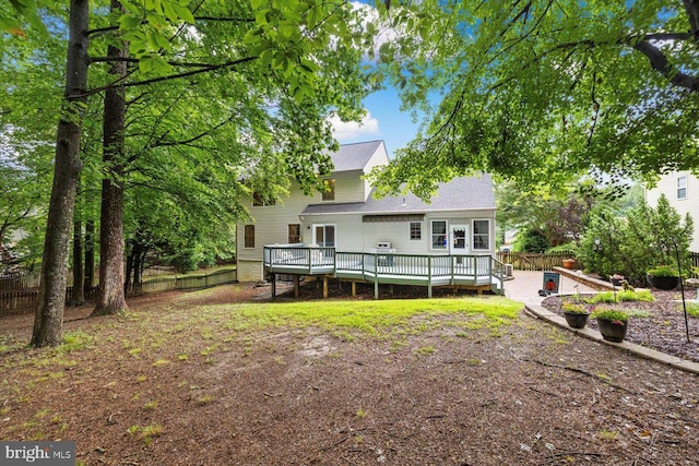 69 Cardinal Forest Dr, Fredericksburg, VA 22406 - rear view of property with a deck, a fenced backyard, and roof with shingles