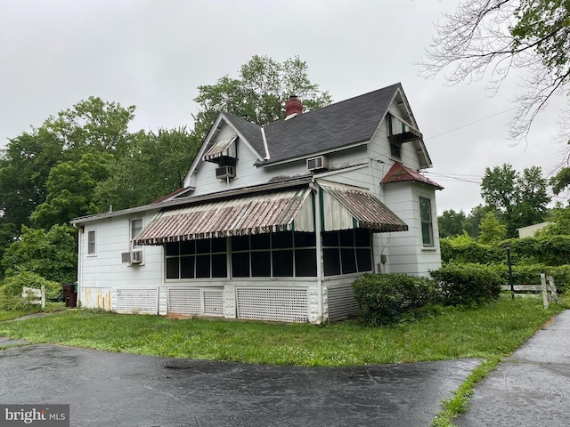 5513 Taylor Rd, Riverdale, MD 20737 - view of side of home with a chimney and cooling unit