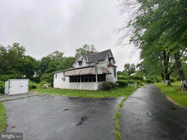 5513 Taylor Rd, Riverdale, MD 20737 - view of property exterior featuring a chimney and a storage shed
