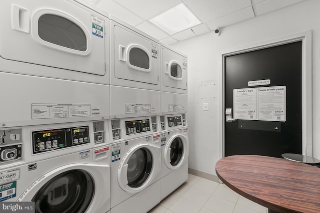 1314 Massachusetts Ave NW Unit 603, Washington, DC 20005 - community laundry with stacked washer / drying machine, washer and clothes dryer, and light tile patterned floors