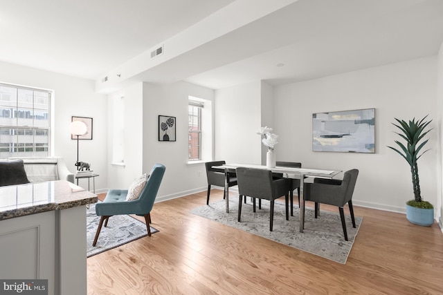 1314 Massachusetts Ave NW Unit 603, Washington, DC 20005 - dining room with baseboards and light wood-style floors