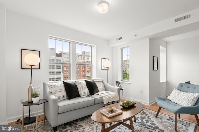 1314 Massachusetts Ave NW Unit 603, Washington, DC 20005 - living area with baseboards and wood finished floors