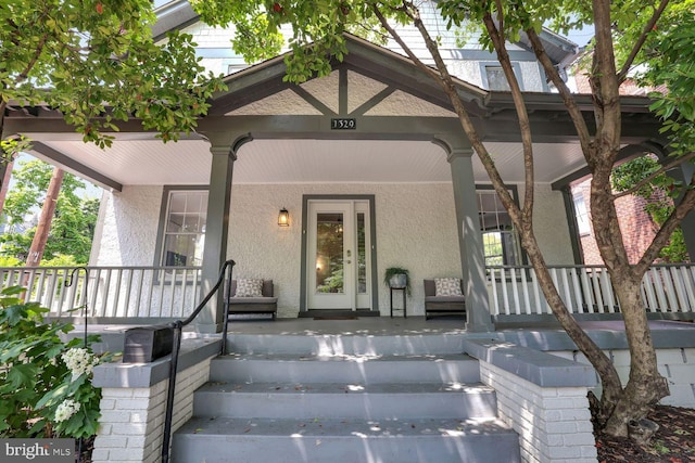 1329 Delafield Pl NW, Washington, DC 20011 - doorway to property with a porch and stucco siding
