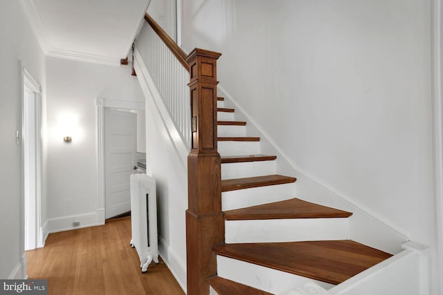 1329 Delafield Pl NW, Washington, DC 20011 - stairs with radiator, wood finished floors, and crown molding