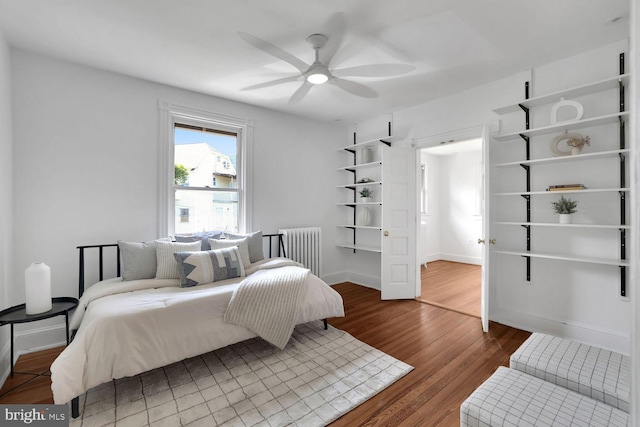 1329 Delafield Pl NW, Washington, DC 20011 - bedroom with radiator, wood finished floors, and a ceiling fan