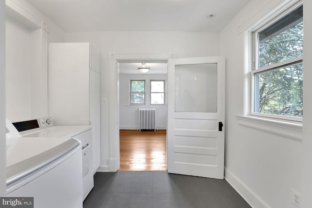 1329 Delafield Pl NW, Washington, DC 20011 - laundry area with separate washer and dryer, radiator heating unit, and dark tile patterned flooring