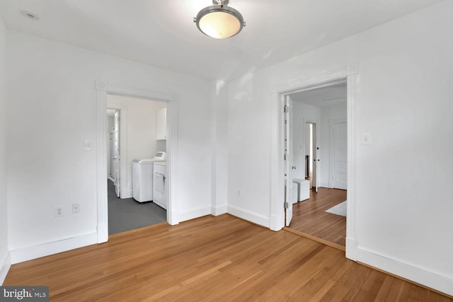 1329 Delafield Pl NW, Washington, DC 20011 - empty room with independent washer and dryer and light wood finished floors