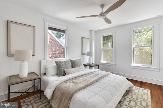 1329 Delafield Pl NW, Washington, DC 20011 - bedroom with multiple windows, wood finished floors, and ceiling fan