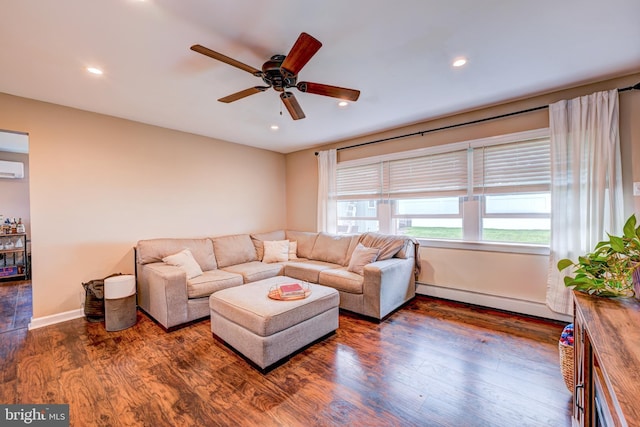67 Neptune Ln, Levittown, PA 19054 - living area with baseboard heating, ceiling fan, wood finished floors, recessed lighting, and a wall mounted AC